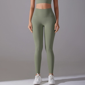 Macro detail of high-waist yoga leggings in olive green with seamless high-stretch fabric