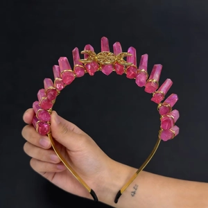 Handheld pink raw crystal crown headband with golden sun and moon metal ornaments