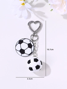 Detail of soccer ball keychain with silver heart clasp and 3D bead showing dimensions