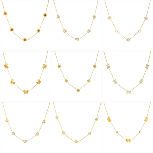 Golden necklace set with butterfly, heart and floral charms in polished finish