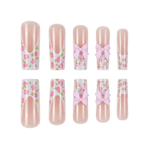 Long coffin fake nails featuring pink floral patterns, white French tips, and 3D bows