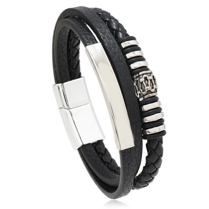 Macro detail of multi-layer black braided leather bracelet with silver magnetic clasp