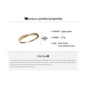 Detailed macro shot of 18k gold plated zircon bangle with precise size measurements