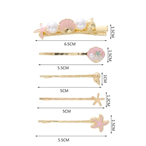 Detailed view of 5 nautical hair clips with sizes from 5cm to 6.5cm on white background