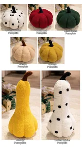 Collection of plush pumpkin pillows in various shapes and warm autumn colors for home decor
