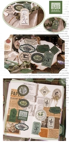 Macro detail of vintage plant stickers with gold foil accents on a wooden desk