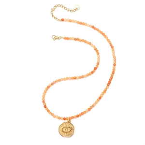 Detail of S925 silver tag and orange beaded necklace with golden eye sun pendant