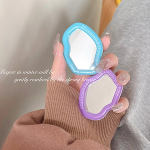 Irregular wavy portable cosmetic mirrors in blue and purple colors for daily makeup