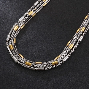 Minimalist silver box chain necklace featuring polished gold cylindrical beads for men