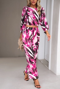 Detail showing the pink and black abstract pattern on long sleeve crop top and trousers