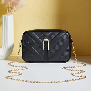 Classic black V-quilted leather crossbody bag featuring an elegant gold chain strap