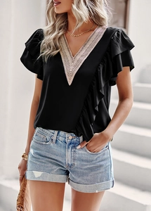 Detail of V-neck short sleeve top with lace trim and ruffle accents for summer wear