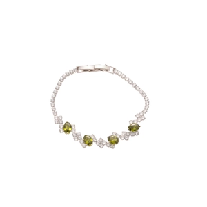 Elegant silver bracelet with sparkling white zircons and oval olive green gemstones