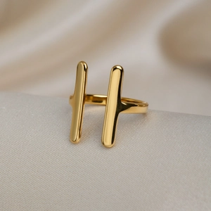 Minimalist double-track open gold ring made of titanium steel on silk fabric