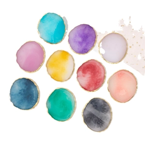 Set of 10 colorful resin agate nail art palettes with gold edges on white background