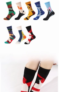 Detail view of abstract Picasso art socks featuring colorful faces and modern patterns