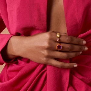 Three S925 sterling silver enamel rings with colorful zircon on pink fabric background