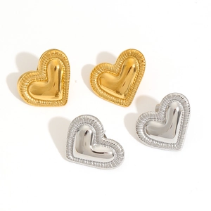 Textured gold and silver heart-shaped stud earrings with pleated edge on white background