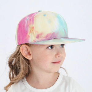 Side view of kid wearing a colorful tie-dye flat brim baseball cap with vibrant patterns