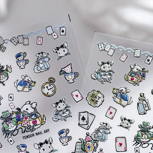 Alice in Wonderland themed nail art stickers with vintage clocks and tea party elements