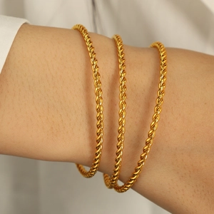 Three-piece set of trendy gold twisted rope bangles in polished stainless steel for women