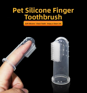 Detailed view of clear silicone pet finger toothbrush with soft bristles and massage bumps