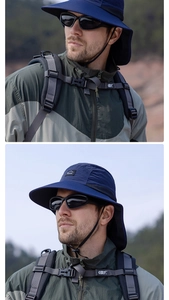 Close-up of dark blue sun hat with wide brim and neck flap for outdoor sun protection