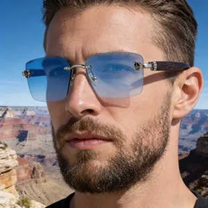 Close-up of frameless aviator sunglasses with blue gradient lenses and wood grain temples