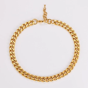Detailed close-up of golden chunky Cuban chain necklace with adjustable lobster clasp