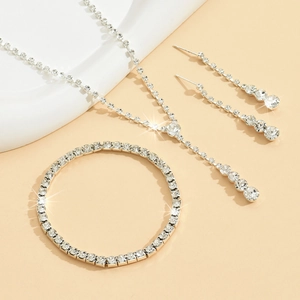 Elegant silver bridal jewelry set with sparkling crystals including necklace and earrings