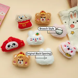 Assorted cute plush animal pins including bears and bunnies with detailed embroidery