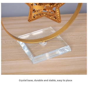 Detail of clear crystal square base with gold metal ring for Christmas tree ornament