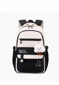 Front view of contrast nylon school backpack with cloud charm and printed patterns