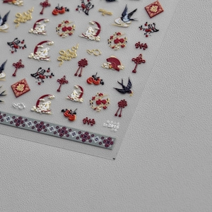 Detail of 5D embossed nail stickers featuring rabbit and floral traditional motifs