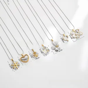 Detail view of flower and heart pendants showing diverse gold and silver metal textures