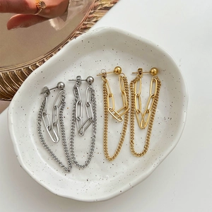 Double-layered gold and silver tassel chain earrings in a stylish minimalist metal design