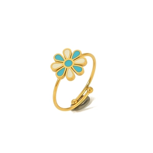 Detailed close-up of a bohemian gold daisy ring with blue and white enamel petals
