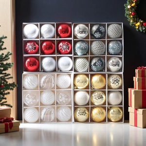 Detailed view of assorted Christmas ball ornaments in festive gift boxes with varied textures