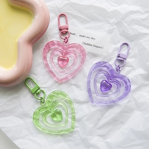 Three-layer nested heart acrylic keychains in pastel pink, purple and green colors