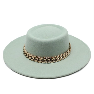 Elegant light green flat top wool hat featuring a stylish gold chain decoration