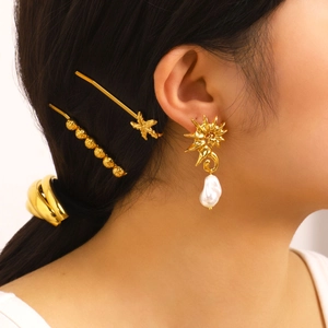 Golden geometric seahorse earrings with Baroque pearl charms and matching hair accessories