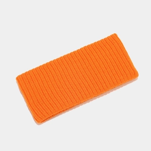 Detail of orange ribbed knit headband showing high-elasticity texture for sports