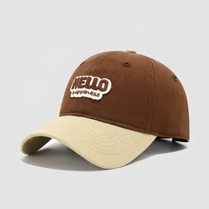 Detail of kids' cotton baseball cap featuring HELLO happiness embroidery and contrast brim