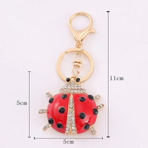 Detailed dimensions of red ladybug keychain with rhinestones and golden metal hardware