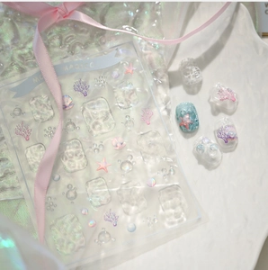 Detail view of 3D embossed ocean nail stickers with shells pearls and starfish