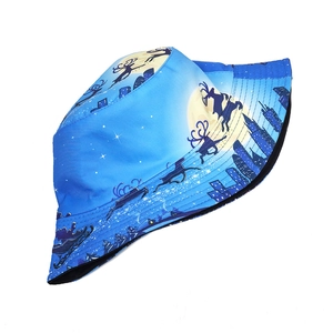Detail of royal blue bucket hat with reindeer stars and city silhouette prints