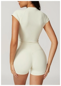 Detail view of high-waist fitness shorts and cropped top with ergonomic back stitching
