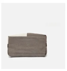 Detailed view of reinforced stitching and bicolor canvas bottom on the large tote bag