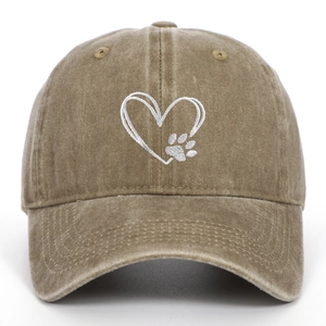 Close-up of heart and dog paw embroidery on washed brown cotton baseball cap