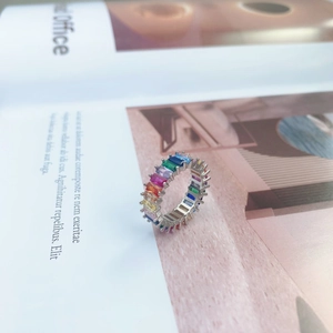 Macro shot of S925 sterling silver stamp and colorful stones on a textured ring